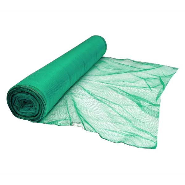 Green heavy duty plastic debris netting fitted to scaffolding on a construction site