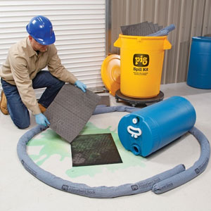 Industrial spill containment area with absorbent socks, pads and spill response equipment.