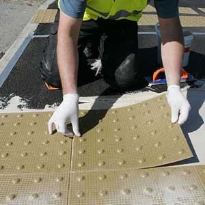durable surface mounted tactile paving for UK public spaces