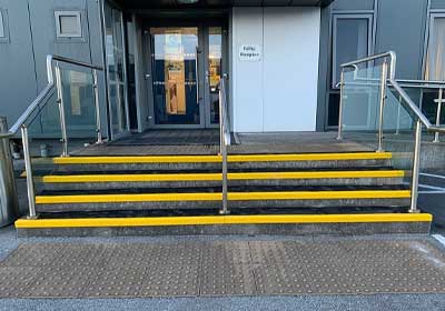Close-up of GRP stair nosing installed on outdoor steps for slip prevention