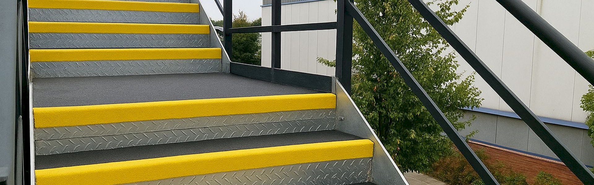 Welcoming image of Mafson Limited’s facility entrance, with signage, clean access points, and professional staff in PPE ready to assist