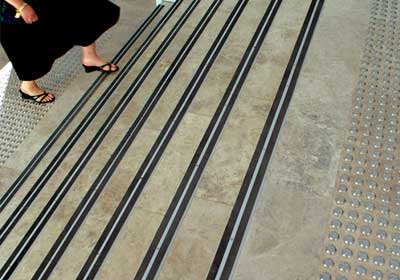Close-up of anti-slip stair treads on wooden stairs for home safety