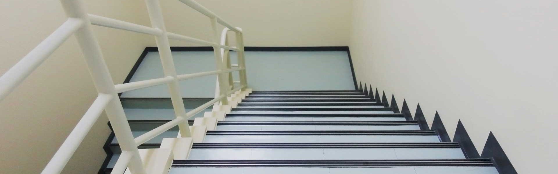 Modern staircase with anti-slip mats installed for stylish and secure design